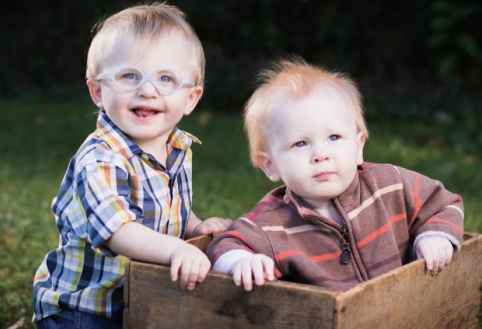 Two small children posing for a photo