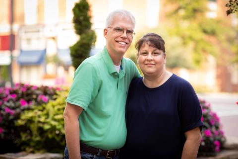 Couple standing together outside